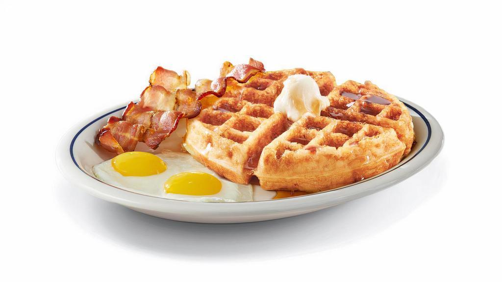 Gluten-Friendly Belgian Waffle Combo · A golden-brown, gluten-friendly Belgian waffle topped with whipped real butter. Served with 2 eggs* your way and two bacon strips or two pork sausage links.