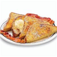 55+ French Toast · Four triangles served with 2 bacon strips or 2 pork sausage links.
