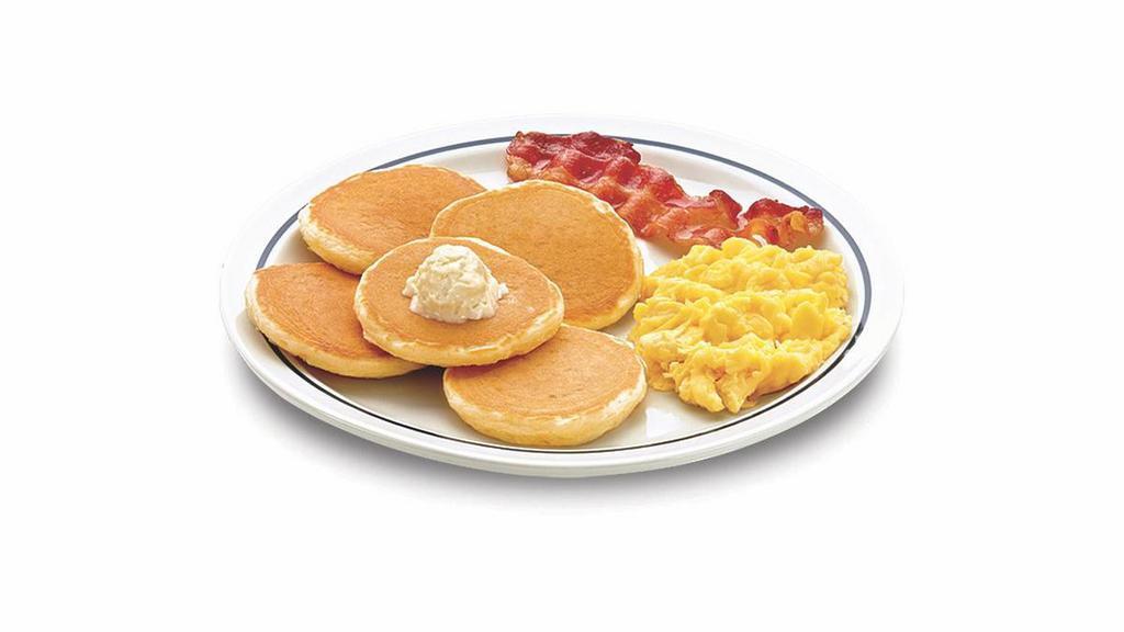 Silver 5 · Five silver dollar buttermilk pancakes, 1 scrambled egg & 1 custom-cured hickory-smoked bacon strip.