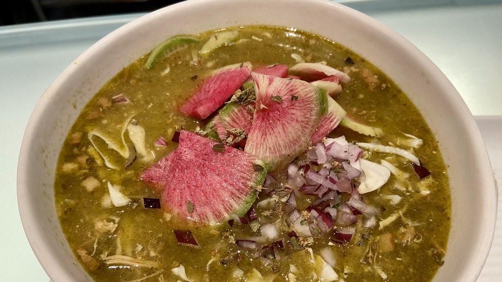 Pozole Verde · Tomatillo stew with locally sourced chicken, bacon, serrano, cilantro and hominy topped with onion, cabbage, watermelon radish. Housemade corn tortilla chips.