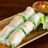 Fresh Spring Rolls · Shrimp, and fresh vegetables wrapped in rice paper, served with peanut butter sauce.