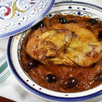 Chicken Tagine · Chicken, lemon confit, onions, saffron, olives.