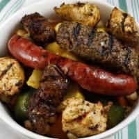 Royal Couscous · Couscous, grilled meat combo, garbanzo beans, vegetables.