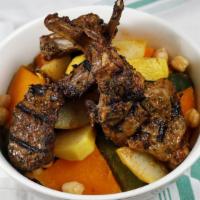 Lamb Chops Couscous · Couscous, grilled lamb chops, garbanzo beans, vegetables.