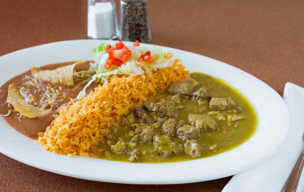 Chile Verde · Pork in green sauce, served with rice, refried beans, lettuce, cheese, pico de gallo and warm tortillas.