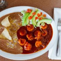 Camarones A La Diabla · Spicy Shrimp served with refried beans, rice, cheese, lettuce and choice of tortillas.