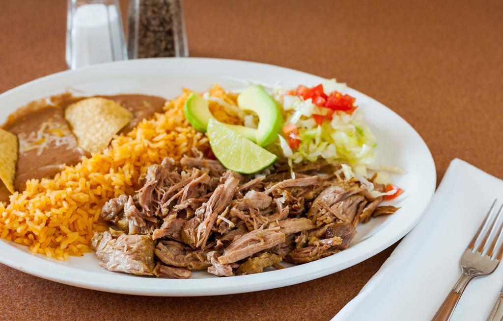 Carnitas Platter · Comes with rice and beans. Tender pork served with rice, refried beans, lettuce, cheese, pico de gallo, and warm tortillas.