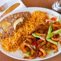 Camarones Empanizados · Breaded shrimp, served with refried beans, rice, lettuce, cheese, choice of tortillas.