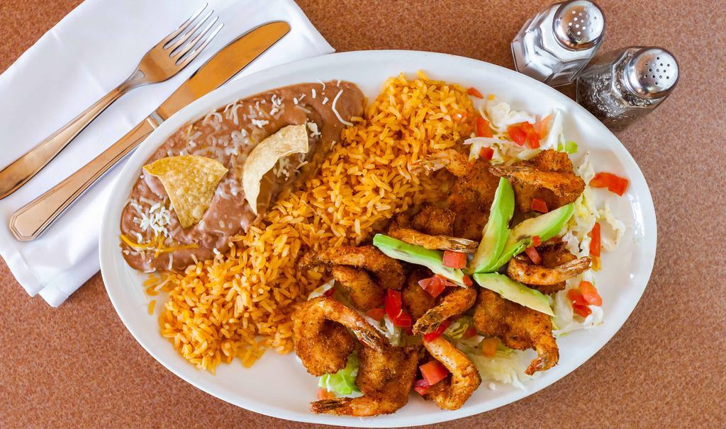 Camarones Empanizados · Breaded shrimp, served with refried beans, rice, lettuce, cheese, choice of tortillas.