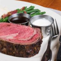Prime Rib - The Cowboy Cut · Seasoned, seared, and roasted to perfection. Choice of fresh or creamy horseradish sauce.