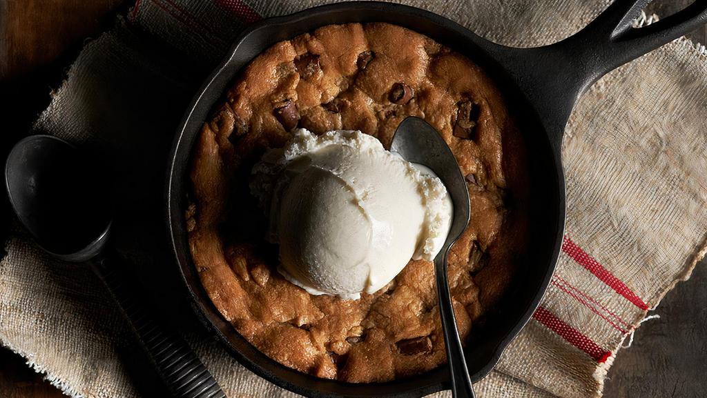 Chocolate Chip Cowboy Cookie · Fresh from the oven, topped with vanilla ice cream.