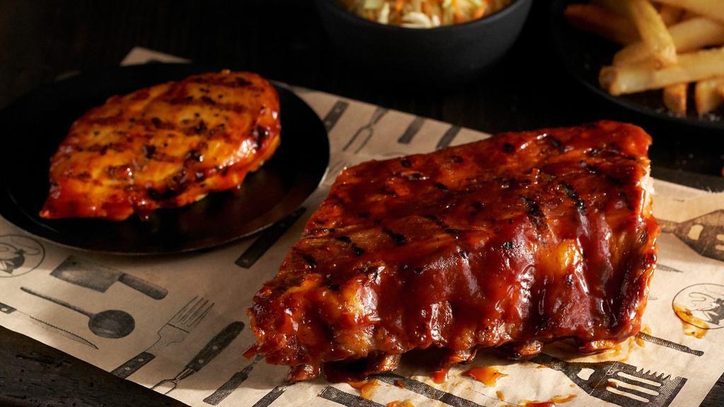 Bbq Chicken & Ribs · A grilled chicken breast and a half rack of Pork Ribs both smothered in our smoky molasses BBQ sauce.