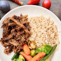 Healthy Brown Rice and Steak Bowl  · brown rice, sauteed vegetables and nieman cut steak