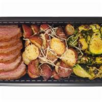 Tri Tip Family Meal · 1 lb. Santa Maria Tri Tip, 8 oz. Roasted Brussels Sprouts, 1 lb. Scalloped Potatoes.