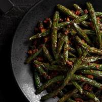 Chili-Garlic Green Beans · Fiery red chili sauce, fresh garlic, Sichuan preserves