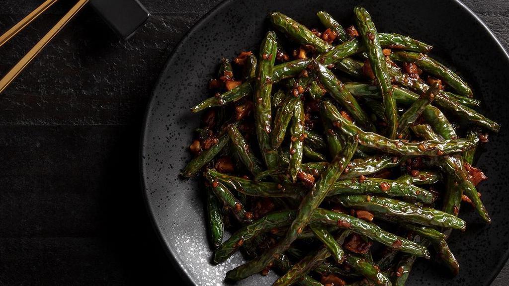 Chili-Garlic Green Beans · Fiery red chili sauce, fresh garlic, Sichuan preserves