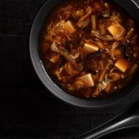 Hot & Sour Soup Cup · Rich and tangy broth, silken tofu, chicken, bamboo shoots, egg