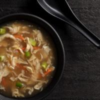 Egg Drop Soup Cup · Velvety broth, julienned carrots, green onion