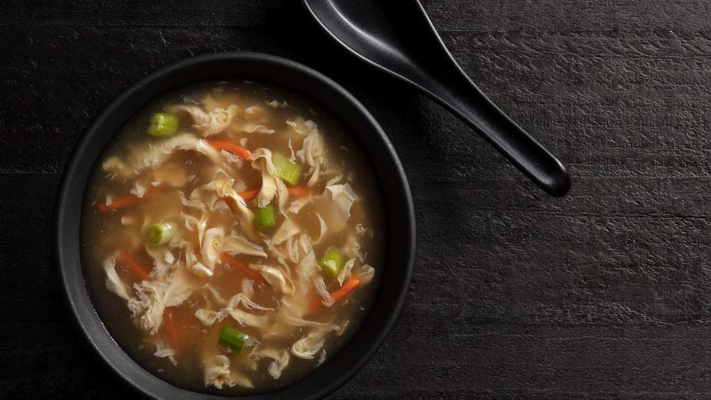 Egg Drop Soup Cup · Velvety broth, julienned carrots, green onion