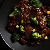 Beef With Broccoli · Flank steak, ginger-garlic aromatics, green onion, steamed broccoli.