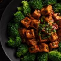 Ma Po Tofu · Crispy silken tofu, spicy red chili sauce, steamed broccoli