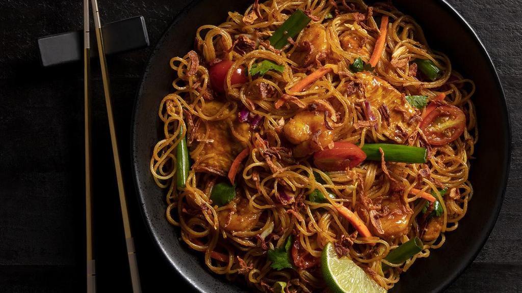 Singapore Street Noodles · Thin rice noodles, light curry sauce, chicken, shrimp, onion, julienned vegetables
