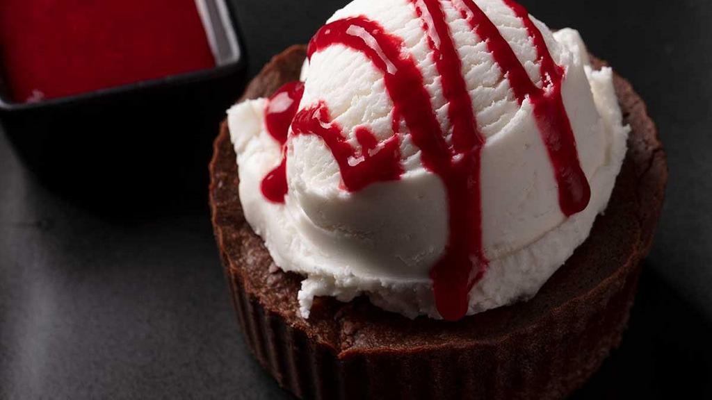 GF Chocolate Souffle  · Chocolate soufflé, vanilla ice cream, raspberry sauce.