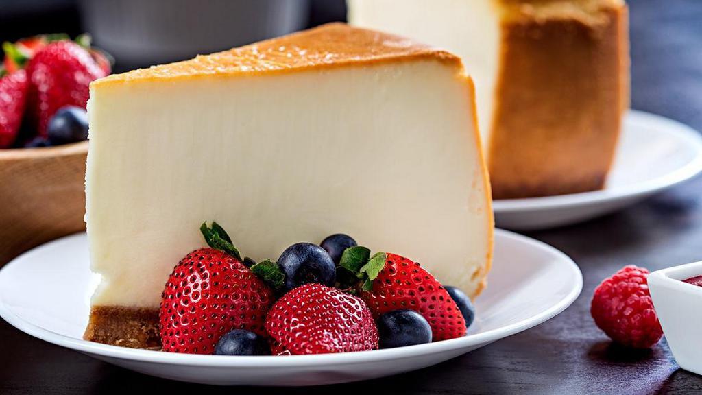 New York-Style Cheesecake · Creamy cheesecake, graham cracker crust, fresh berries