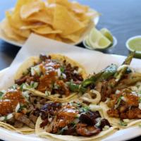 Regular Tacos · Choice of meat, salsa, cilantro onion.