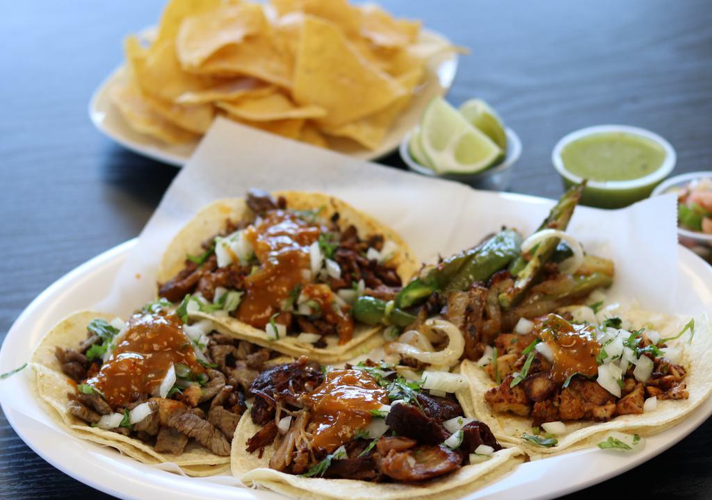 Regular Tacos · Choice of meat, salsa, cilantro onion.