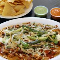 Huaraches · Meat, beans, sour cream, cilantro, cheese, and salsa.