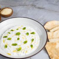 Tzatziki with warm pita · Cucumber-garlicky yogurt dip with olive oil, mint served with warm pita.
