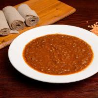 Misir Wot (MW) · Red lentils, caramelized onions, garlic, ginger, berbere, coriander and spices. With injera.