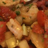 Tostada De Ceviche De Camaron · Shrimp cooked in lime juice. Served with rice, salad, and beans.