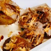 Takoyaki ( 6 ) · Deep fried octopus balls, dried bonito flakes, sesame seed, teriyaki sauce, spicy mayo.
