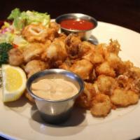 Panko Crusted Calamari · Tender cutlets quickly fried & served with chipotle aioli & cocktail dipping sauce on the si...