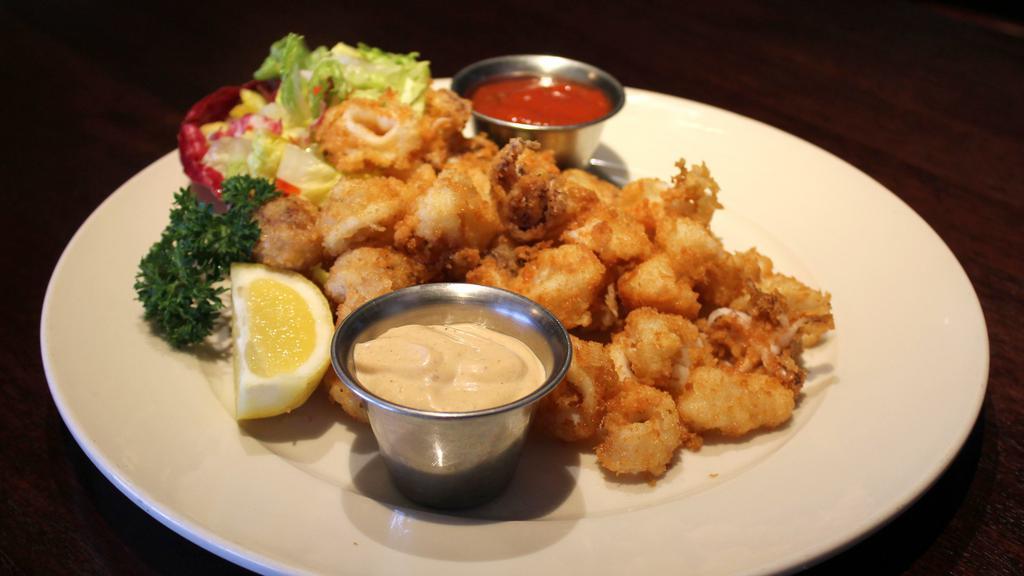 Panko Crusted Calamari · Tender cutlets quickly fried & served with chipotle aioli & cocktail dipping sauce on the side.