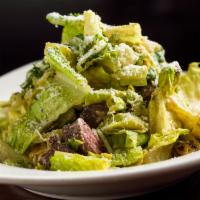 Grilled Chicken Caesar · Crisp romaine hearts, grilled marinated chicken breast, rustic croutons, parmesan reggiano c...