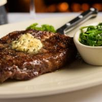 USDA Prime Ribeye Steak, 15 oz. · Specially aged for tenderness & well marbled for peak flavor.  Served with Herbed Steak Butt...