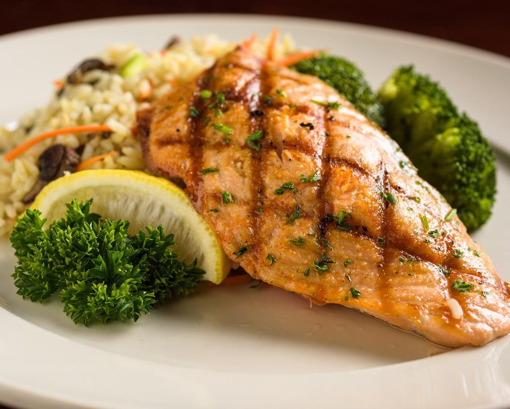Fresh Scottish Salmon · Organically farm-raised in crystal waters of Northern Scotland. Open flamed grilled and served with a dill caper sauce on the side.   Served a la carte.  Sides dishes are ordered separately.