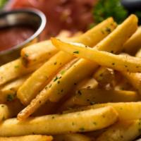 French Fries · Russet potato fries tossed with sea salt & parsley flakes. Ketchup on the side.