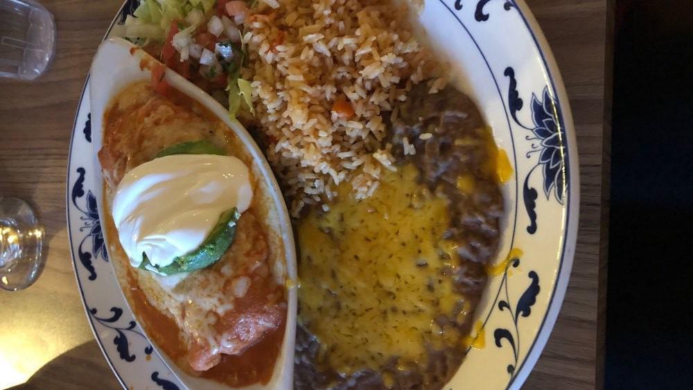 Crab Enchilada · Sautéed crab with mushrooms, green onions, corn wine. Wrapped in a flour tortilla with ranchero sauce and cheese. Served with avocado and sour cream.