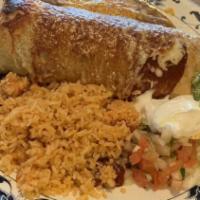 Chimichanga · Deep-fried burrito topped with red chile sauce and cheese. Served with rice, beans, guacamol...