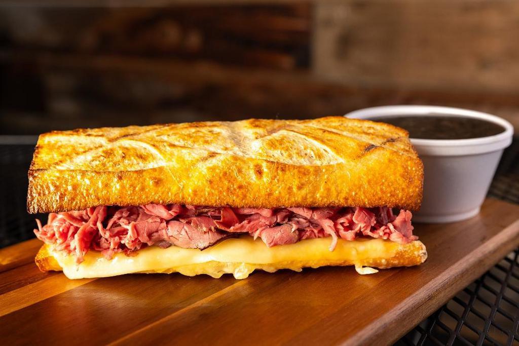 #2 French Dip · Thinly sliced Roast Beef with our House Sauce, Swiss Cheese, served on our freshly baked Sourdough bread with a side of our Au Jus sauce. Please note we typically serve this sandwich hot & toasted!