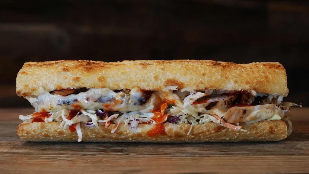 #18 Buffalo Chicken · Grilled Chicken topped with Buffalo Sauce, Pepper Jack Cheese & a house-made Jalapeno Ranch Coleslaw. Served hot & toasted on Freshly Baked Sourdough!
