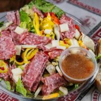 Italian Salad · Chopped Romaine, with Mixed Bell Peppers, Salami, Mozzarella, Tomatoes, Pepperoncinis, Kalam...