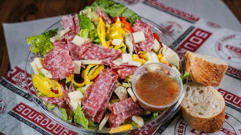 Italian Salad · Chopped Romaine, with Mixed Bell Peppers, Salami, Mozzarella, Tomatoes, Pepperoncinis, Kalamata Olives, Artichoke Hearts & a side of Italian Dressing