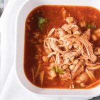 Chicken Pozole Soup · Hominy and chicken, onions, cilantro.