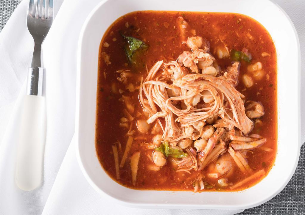 Chicken Pozole Soup · Hominy and chicken, onions, cilantro.