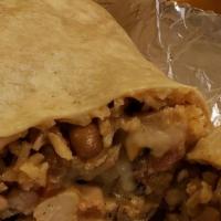 Burrito Wrap al Mojo de Ajo · Flour tortillas, Mexican rice, pinto beans, sauteed garlic shrimps, Monterey jack cheese & p...